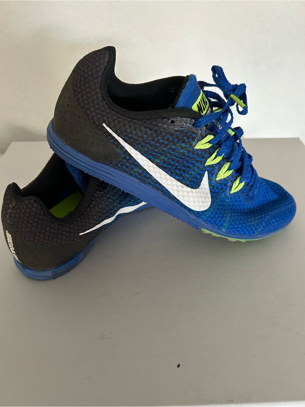 Nike Kids Blue and Black track shoes with White Swoosh and Neon Green Accents